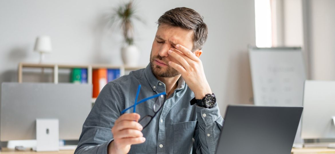 Person experiencing dry eye symptoms, including gritty, watery, and irritated eyes - Eye Max Centre
